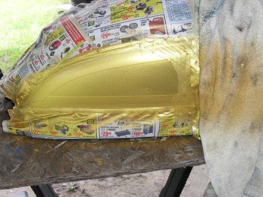 <airbrushing a gas tank>