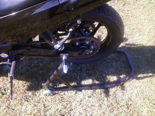 <ex250 ninja on harbor freight swingarm stand>