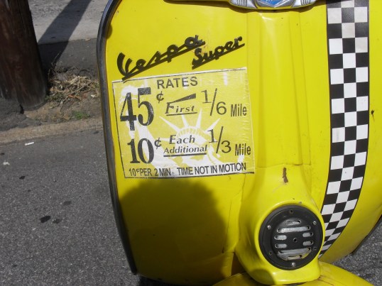 <vintage vespa rental sign>